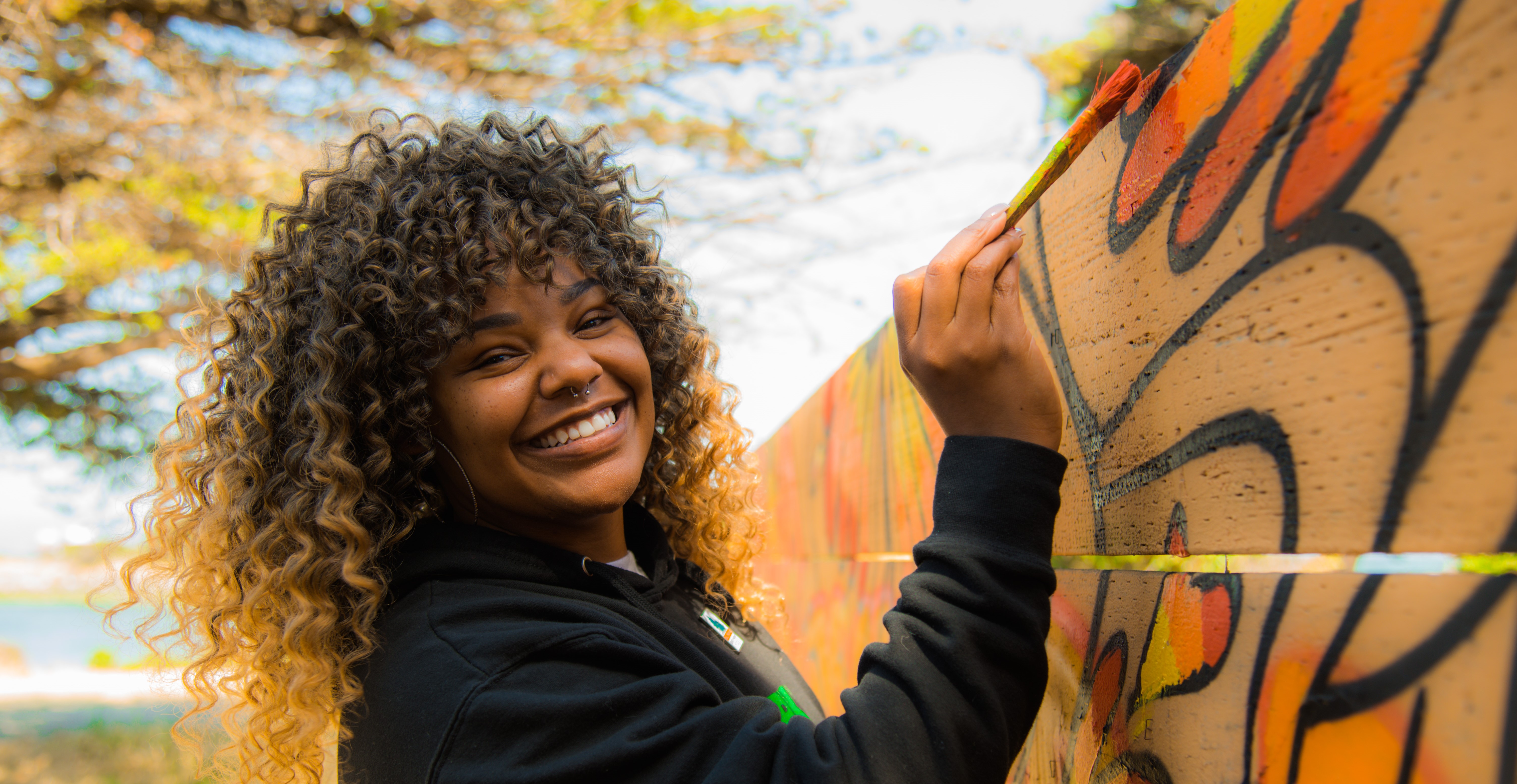 woman painting mural